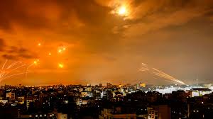 Missiles and air defense systems light up the night sky over Gaza during intense Israeli strikes.