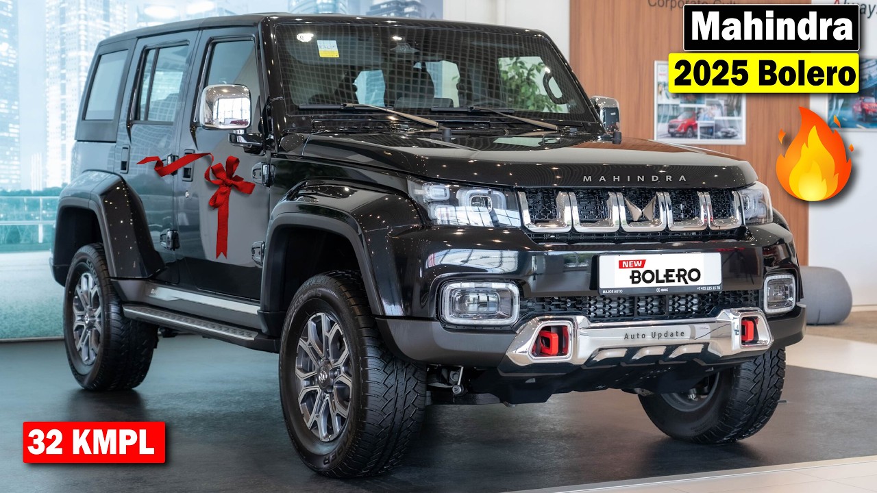 2025 Mahindra Bolero SUV in black color, with a red ribbon on the front, showcasing its modern design and features like 32 KMPL fuel efficiency.